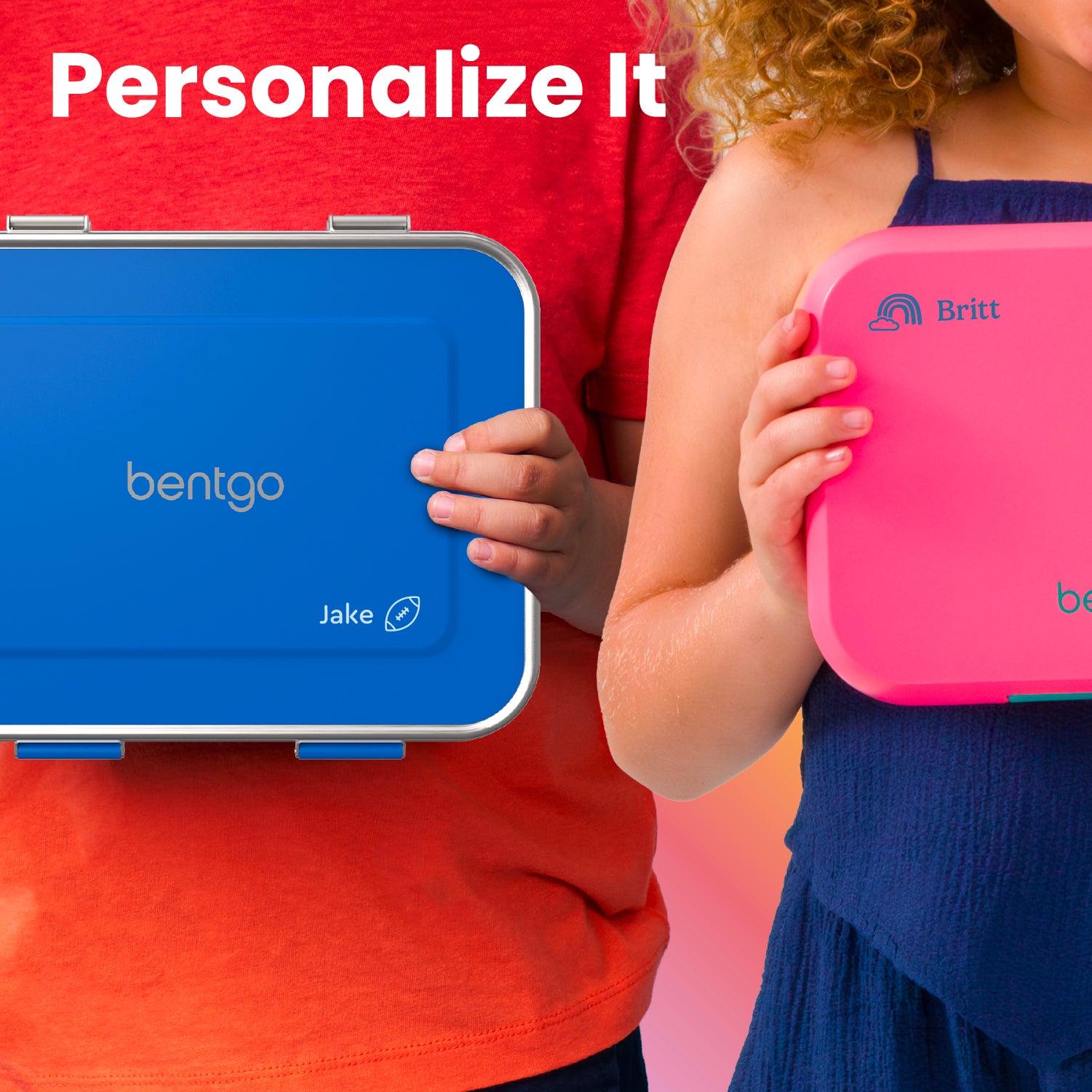 Two children holding blue and pink lunch boxes with personalized names on a multicolored background.